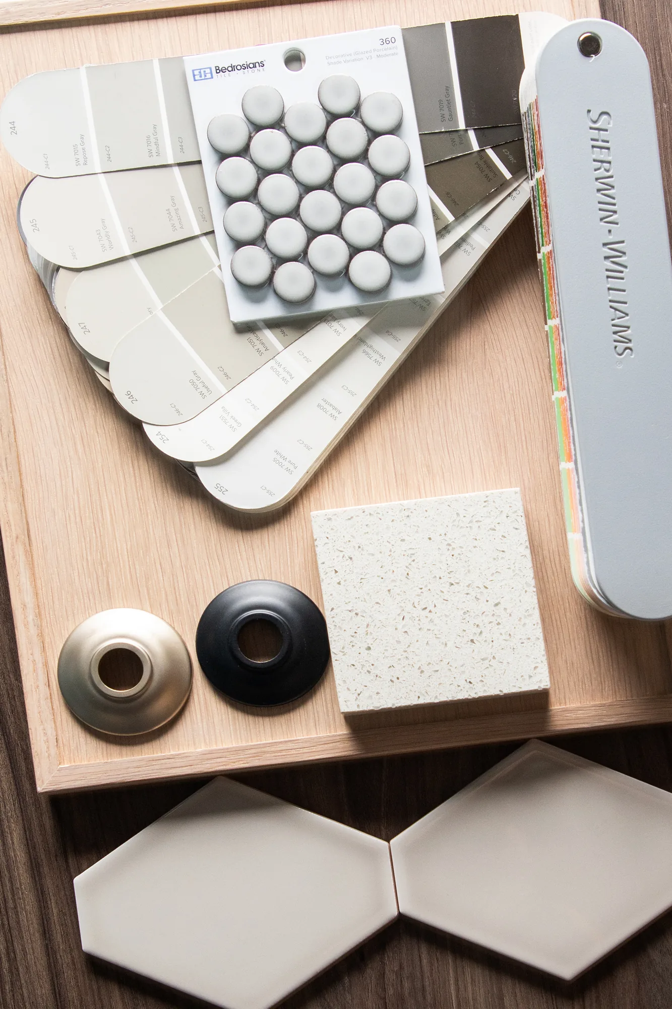 Paint samples, tile and hardware laid out during an ABD finish selection