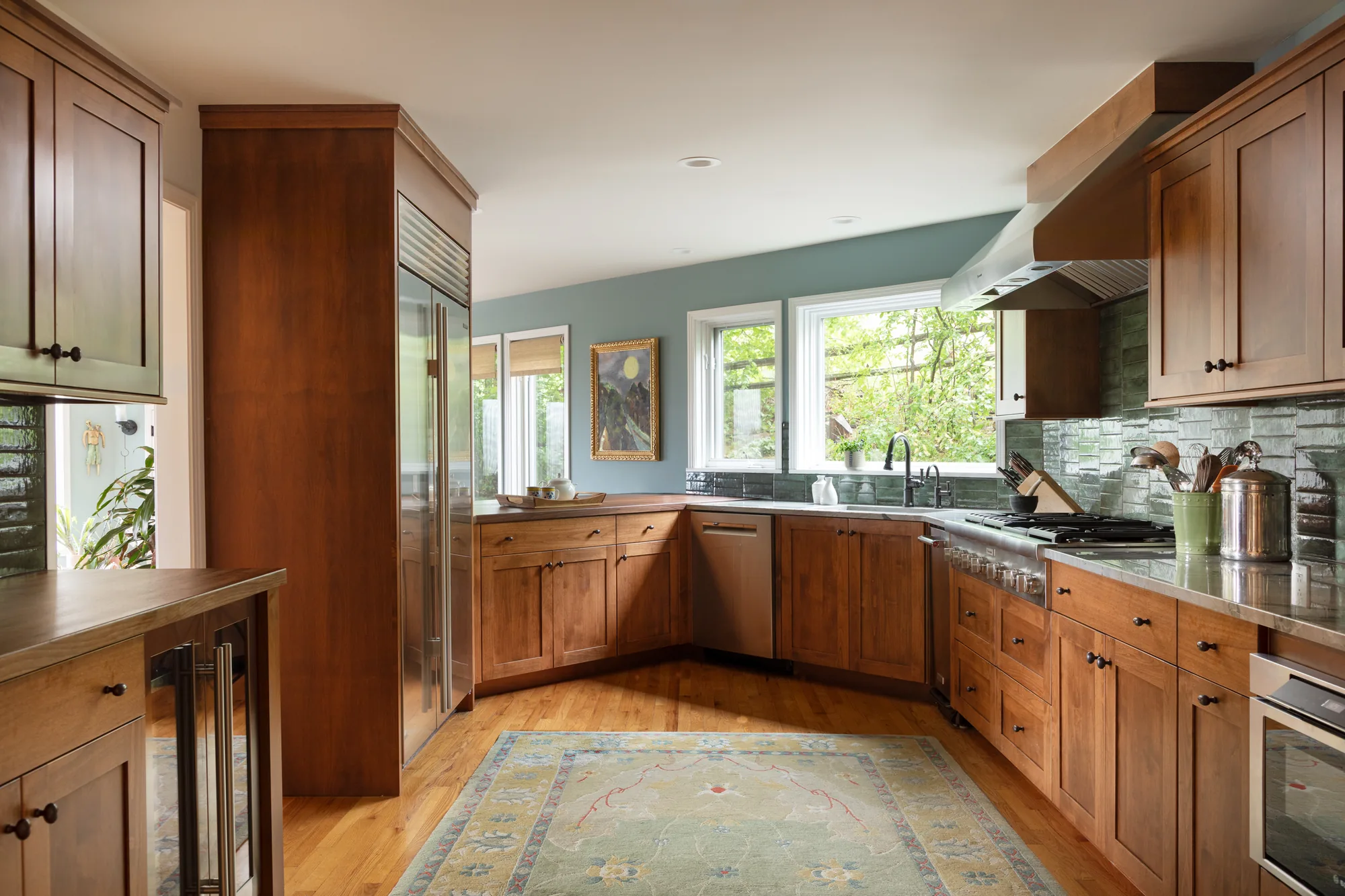 A whole kitchen remodel by ABD with wood cabinetry and a long island