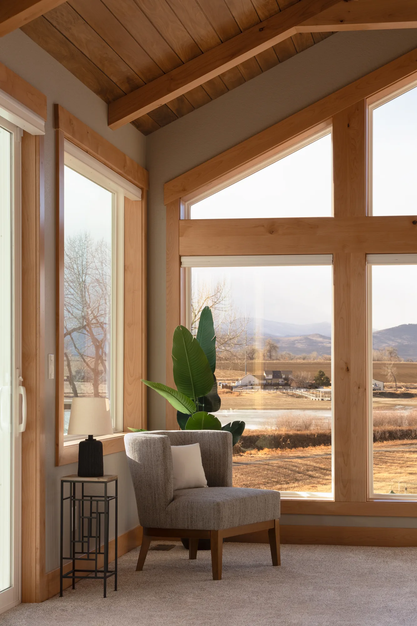 Lake addition with vaulted timber ceiling and tall windows