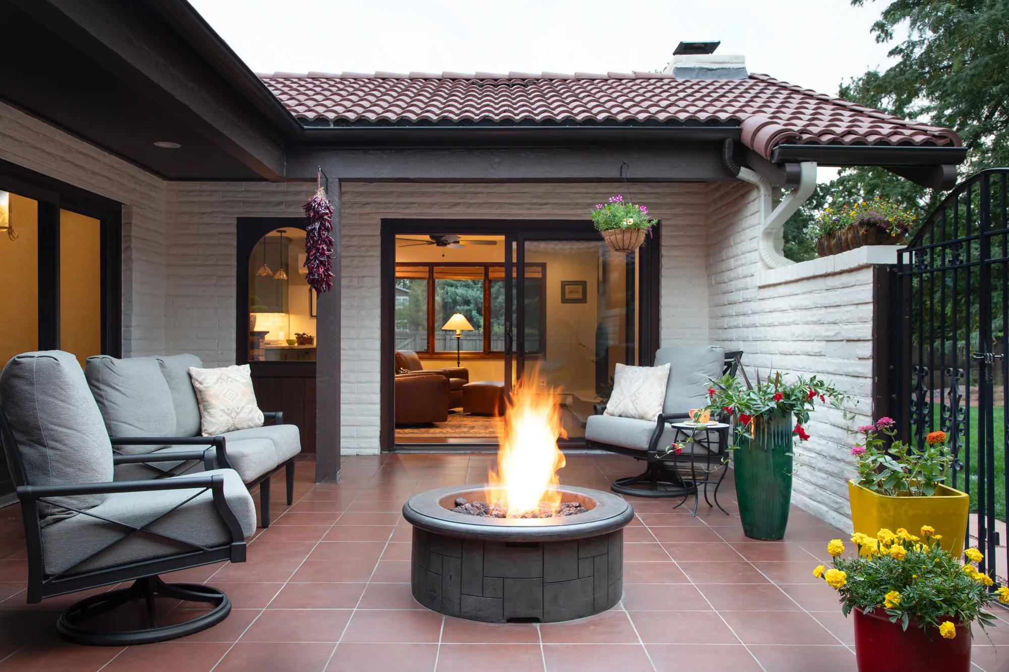 Southwestern patio with a fire pit and covered seating